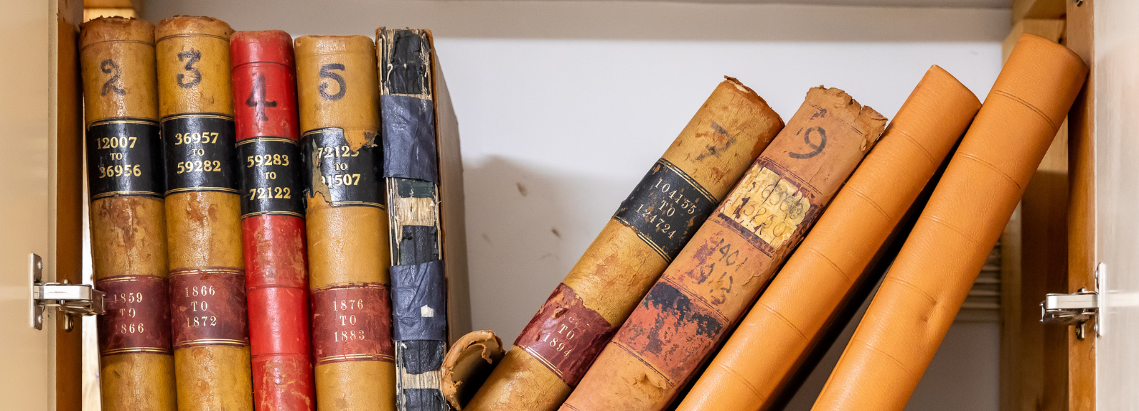 Very old registration books on a shelf