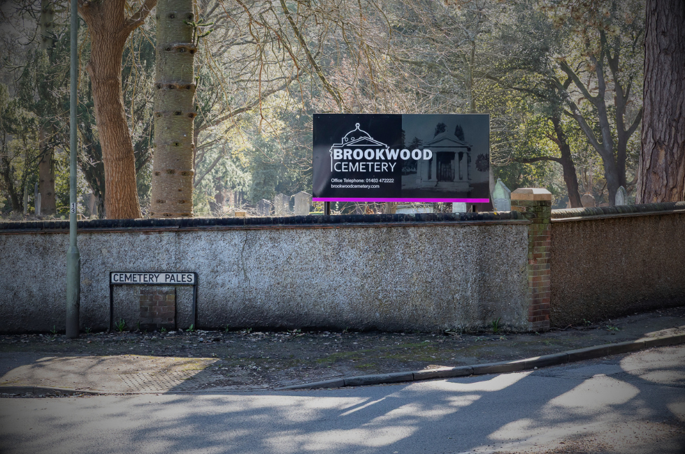 View of the cemetery wall from the junction of Bagshot Road and Cemetery Pales.